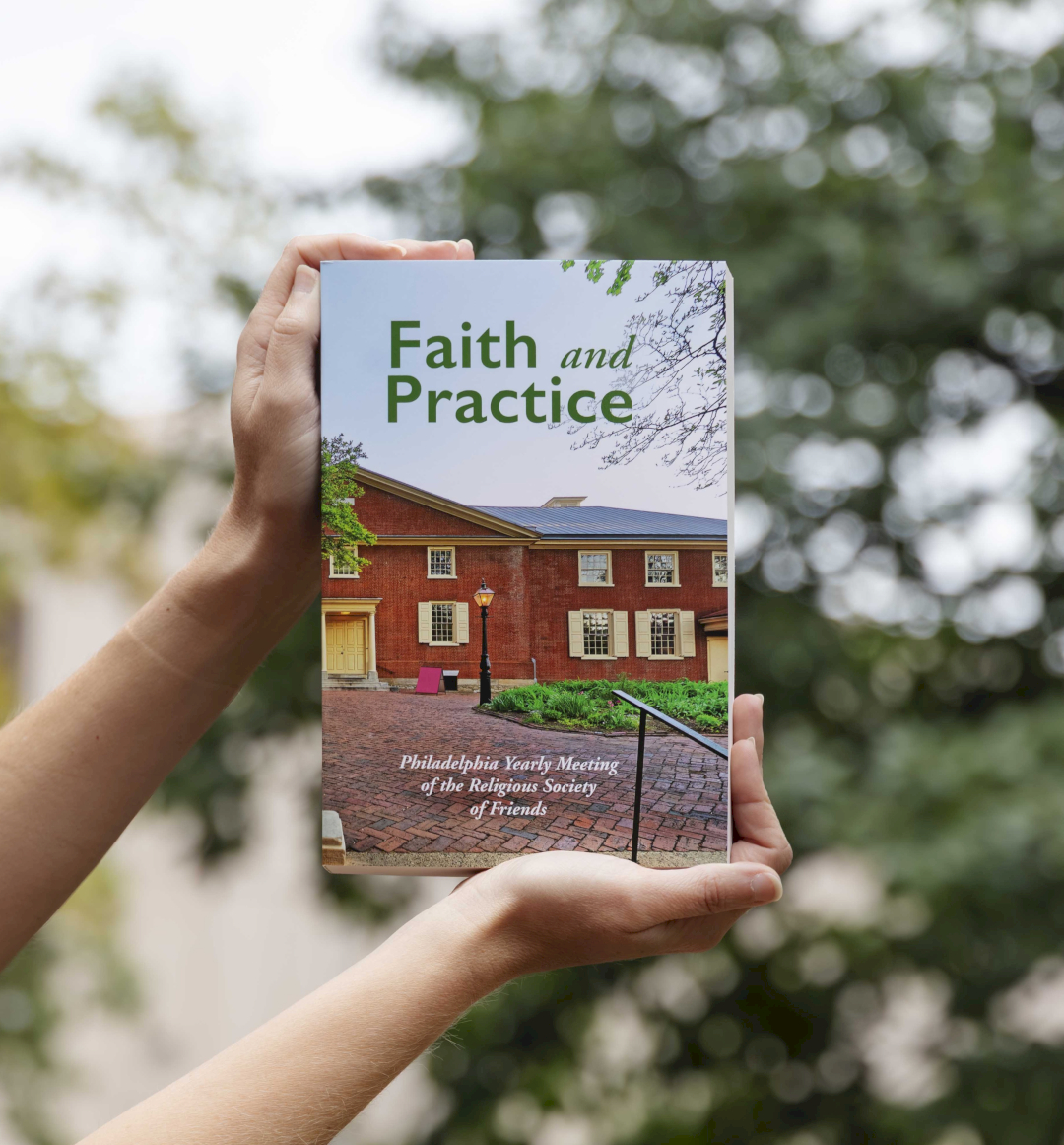 A pair of hands holding a copy of the publication